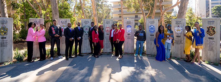 Students standing next to the Plaza pillars.jpg